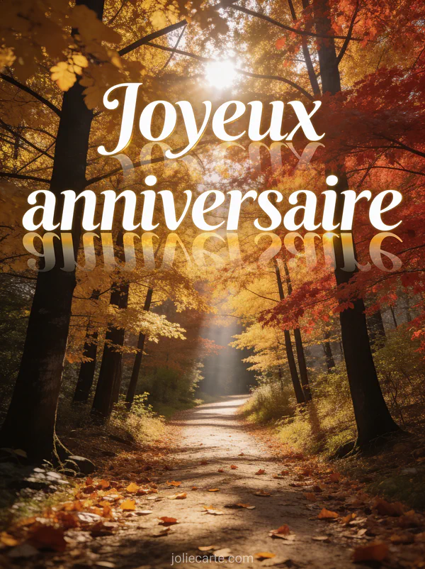 Sentier forestier en automne bordé d'arbres aux feuilles dorées et rouges avec rayon de soleil et tapis de feuilles et texte Joyeux anniversaire