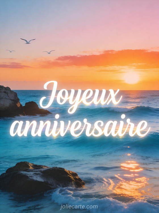 Vue panoramique sur une mer bleu azur avec des rochers et un coucher de soleil orangé avec le texte Joyeux anniversaire