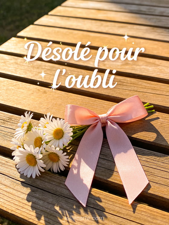 Petit bouquet de marguerites avec un noeud en ruban rose sur une table en bois avec le texte Désolé pour l'oubli