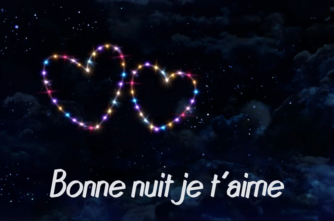 Dans un ciel nocturne étoilé, deux cœurs entrelacés sont formés par des étoiles multicolores et lumineuses, avec le texte 'Bonne nuit je t'aime'.