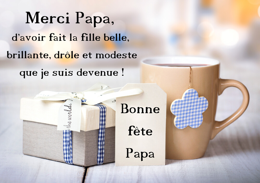 Une composition pour la Fête des Pères montrant un paquet cadeau et une tasse de thé sur une table en bois clair.