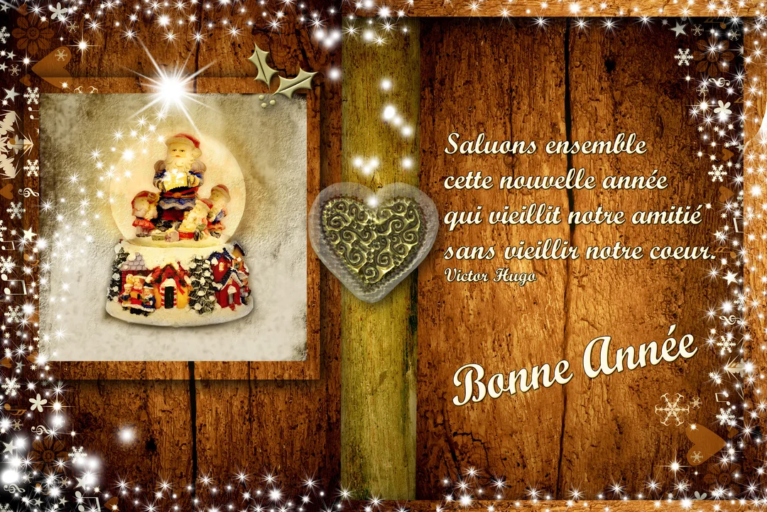 Composition festive pour la nouvelle année sur un fond de bois, montrant une boule à neige, un cœur et une citation de Victor Hugo.