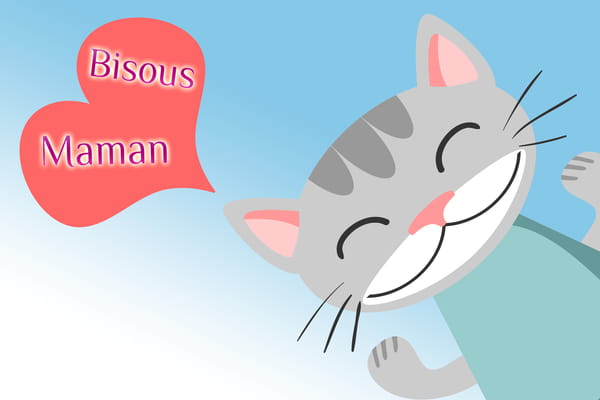 Carte pour la Fête des Mères avec un chaton gris souriant et un cœur rouge où il est écrit 'Bisous Maman'.