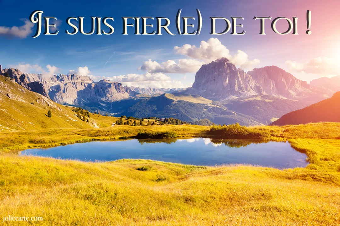 Un paysage de montagne grandiose avec un lac au premier plan, sous un ciel bleu, avec le texte superposé 'Je suis fier(e) de toi'.