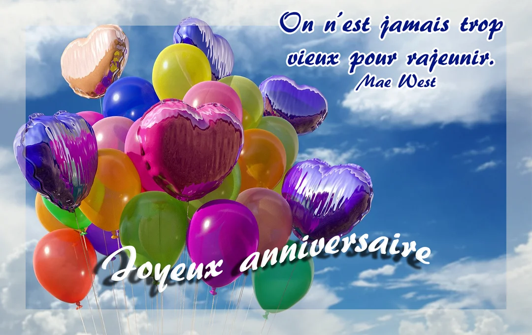 Des ballons de baudruche et en forme de cœur, de toutes les couleurs, s'élèvent dans un ciel bleu parsemé de quelques nuages blancs.