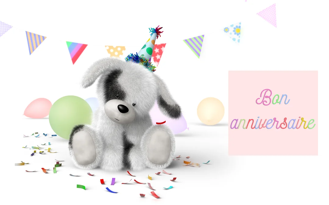 Un chiot en peluche noir et blanc, assis au milieu de confettis et de ballons, porte un chapeau de fête coloré sur fond blanc.